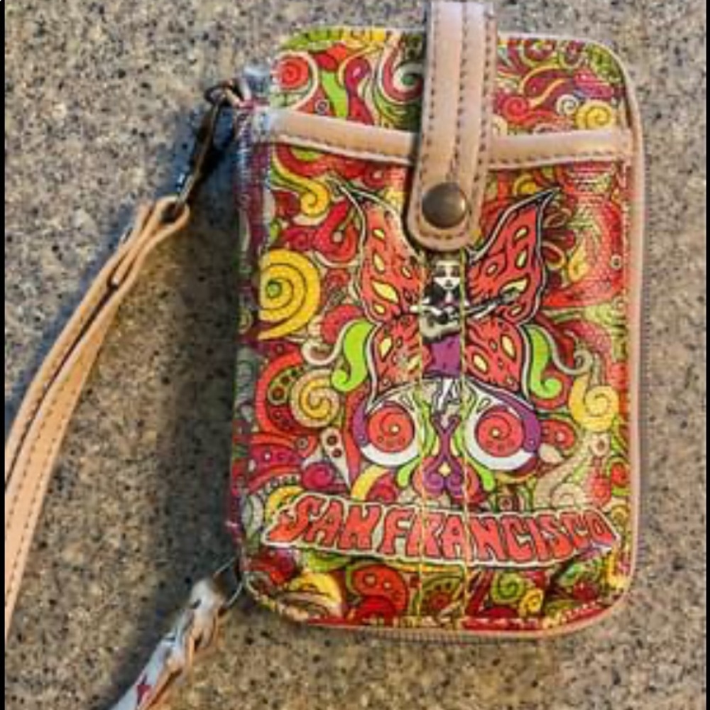 SAKROOTS wristlet and phone case. New, never used.